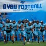 Grand Valley football team runs on the field at start of game